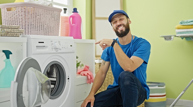 Image showing homeowner enjoying the benefits of a well-maintained washing machine