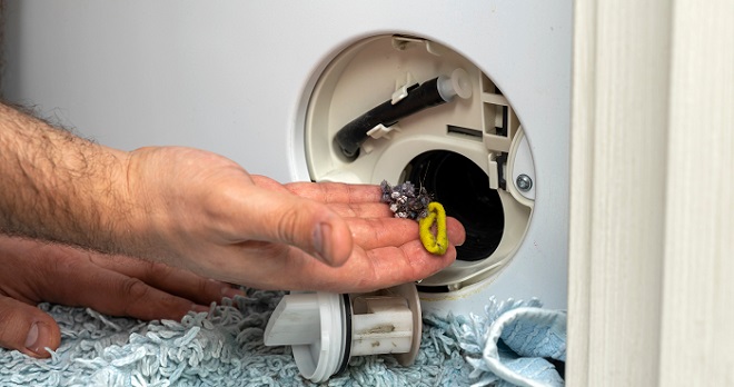 Image of clearing the washer drain pump filter