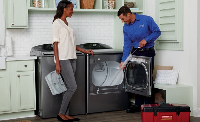 Image of Sears Home Services Technician completing dryer maintenance