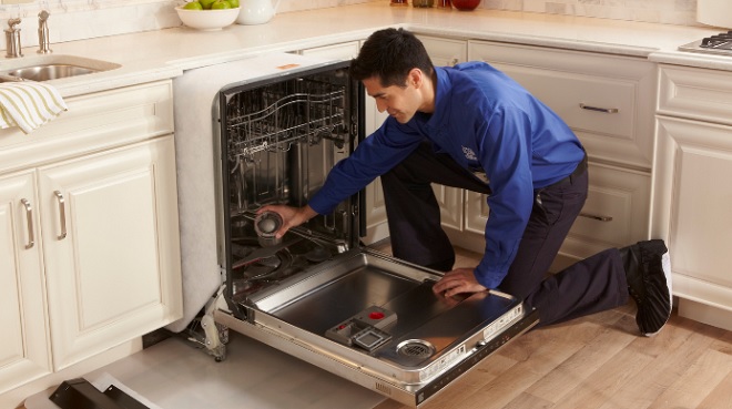 Image of a Houston Sears Tech performing appliance repair