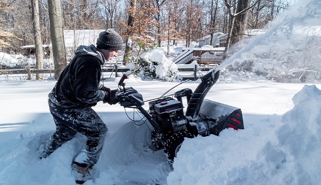 Image of large snowblower clearing snow