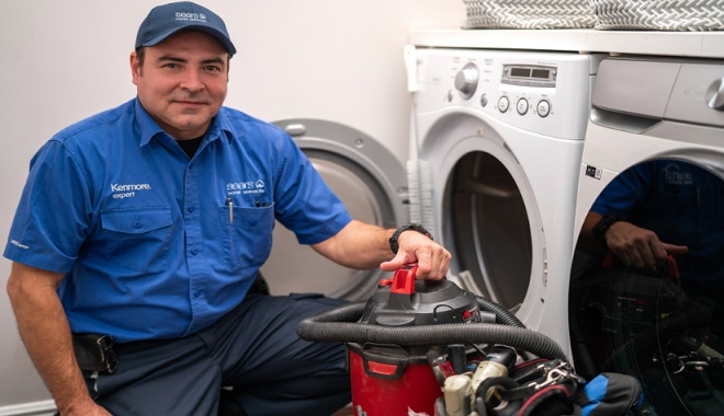 Image of Sears Home Services Technician performing dryer repair
