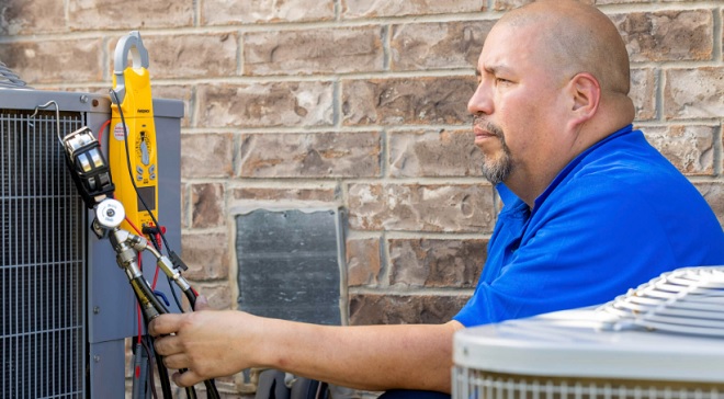 Sears Home Services HVAC Tech checking pressures image