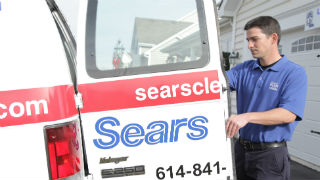Sears upholstery cleaning technician with cleaning van